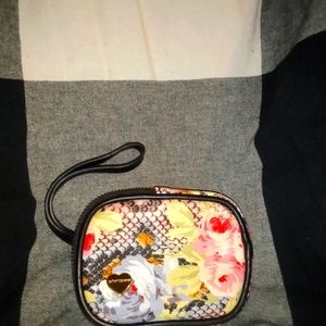 Beautiful Betsey Johnson coin purse with a Flower/Snakeskin print.